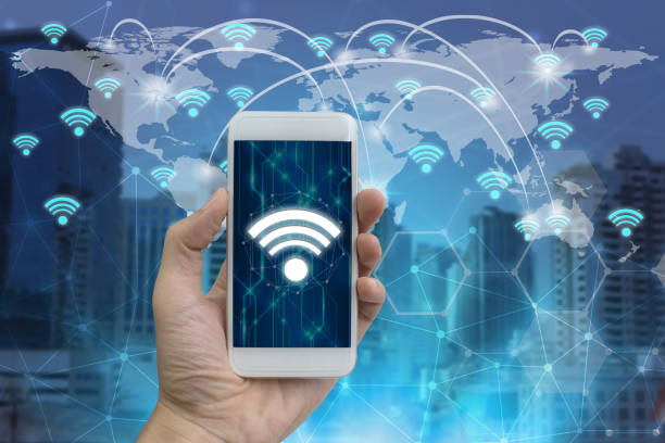 istock Businessman hand use smartphone with wifi icons 950253976