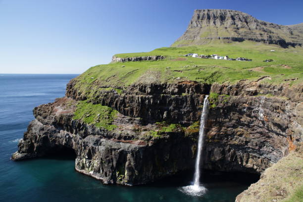 waterfall Gasadalur on faroe islands waterfall Gasadalur on faroe islands mykines faroe islands photos stock pictures, royalty-free photos & images