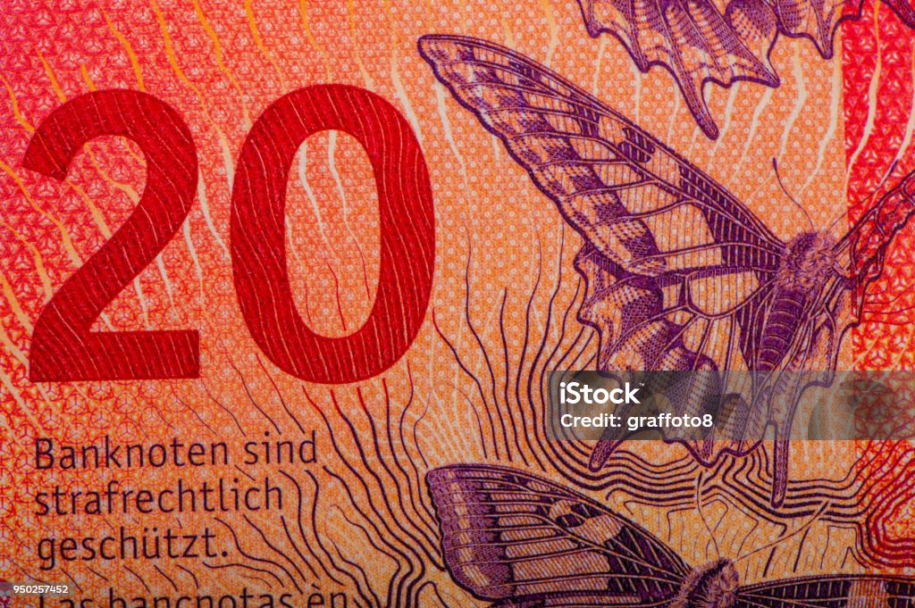 Swiss banknotes - a collection of old and new twenty franc notes. Swiss banknotes - a collection of old and new twenty franc notes. Cash. Bank - Financial Building Stock Photo