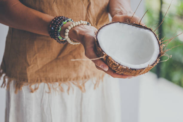 istock Tribal woman with coconut bowl 950257532