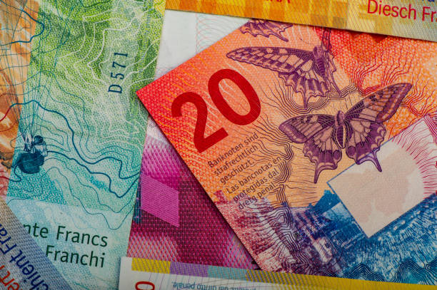 istock Swiss banknotes - a collection of old and new twenty franc notes. 950257542