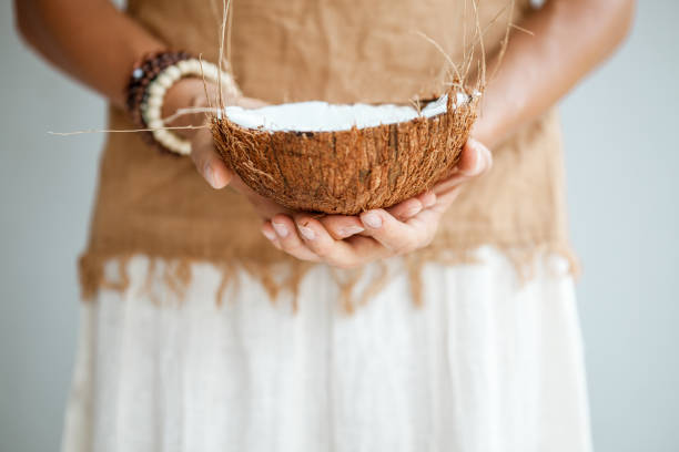 Tribal woman with coconut bowl