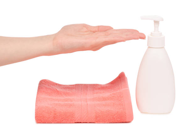 istock Soap with dispenser towels female hands 950261328