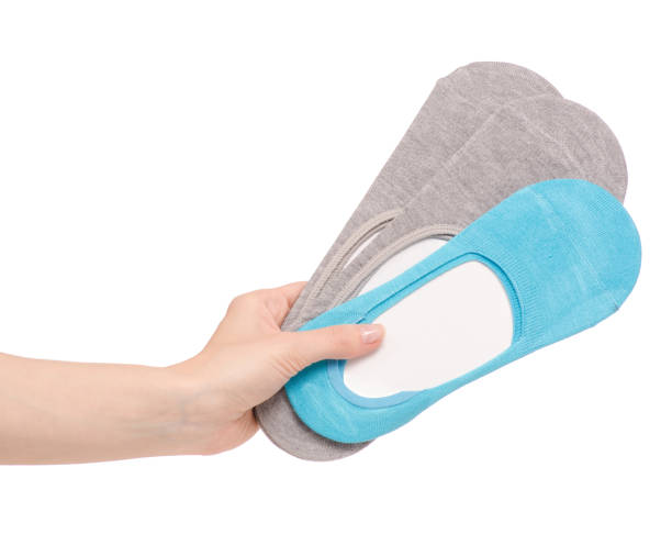 The blue gray no show socks in hand on white background isolation
