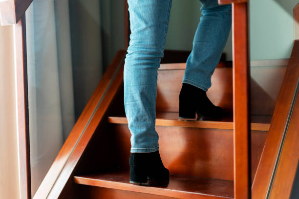 istock walking up on wooden stairs 950262486
