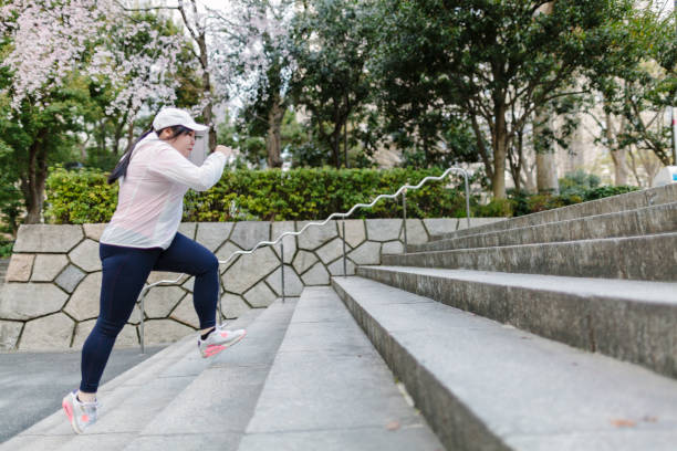 Plus size Japanese woman training at steps