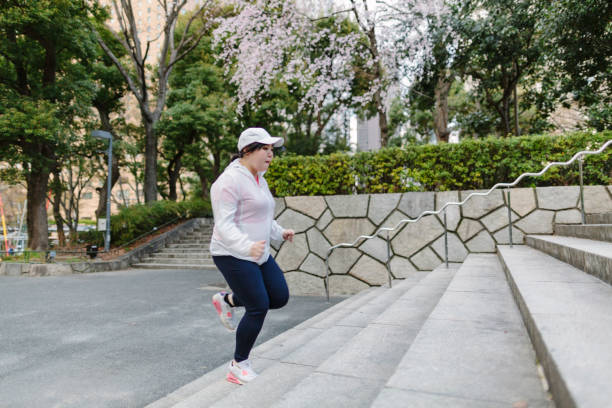 istock Plus size Japanese woman training at steps 950265886