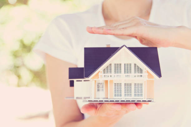 istock Model house in woman hand 950274664
