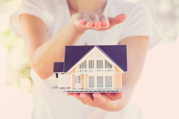 istock Model house in woman hand 950275638
