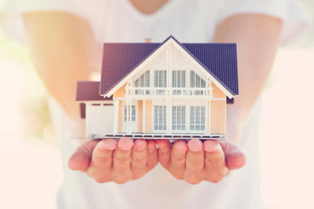 istock Model house in woman hand 950275990