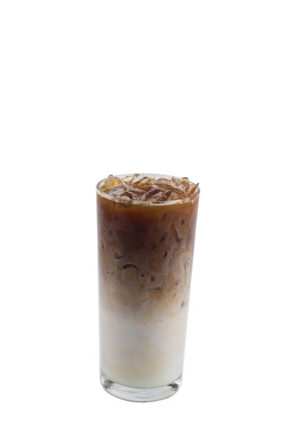 istock Isolate Iced coffee long glass on white background. Iced Caramel macchiato, double layer of Espresso shot coffee and fresh milk bellow.You can drinks this by regular or blend it by stir, it make your feels different. 950283884
