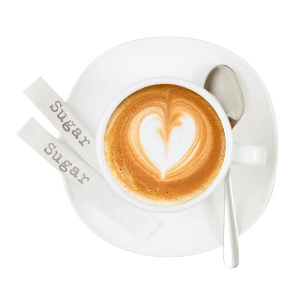 istock White cup and saucer coffee capuccino  heart sugar sticks spoon 950287934