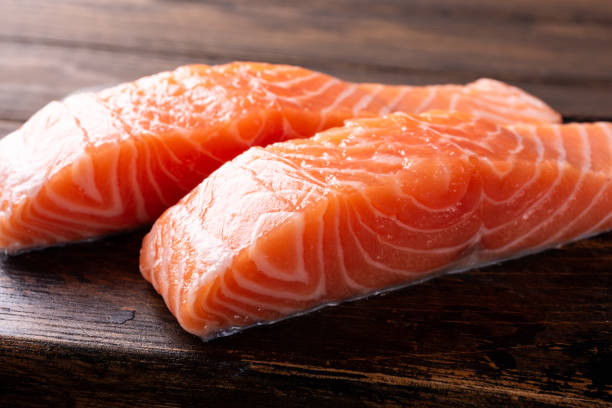istock Fresh raw salmon fillet, flat lay 950289120