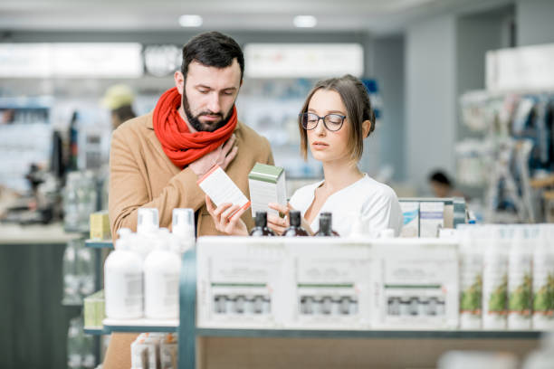 istock Pharmacist with client in the pharmacy store 950292634