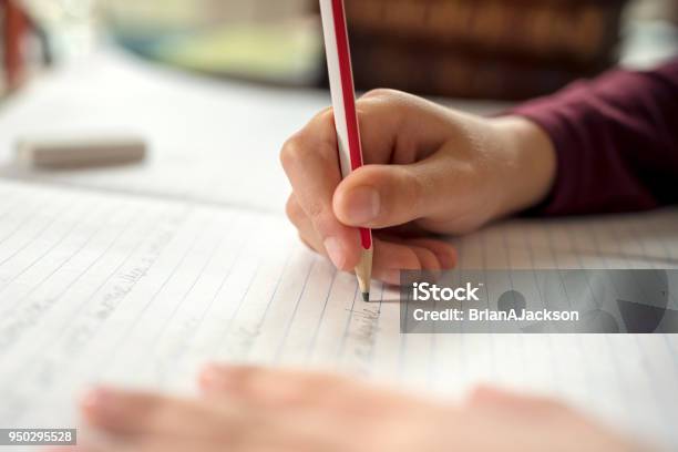 Boy Doing His School Work Or Homework Stock Photo - Download Image Now - Writing - Activity, Child, Homework