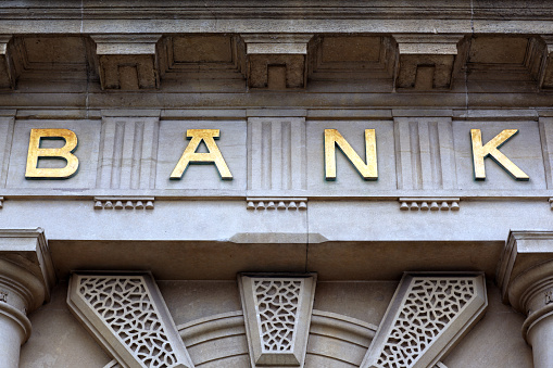 Bank sign above the door of financial building concept for finance and business