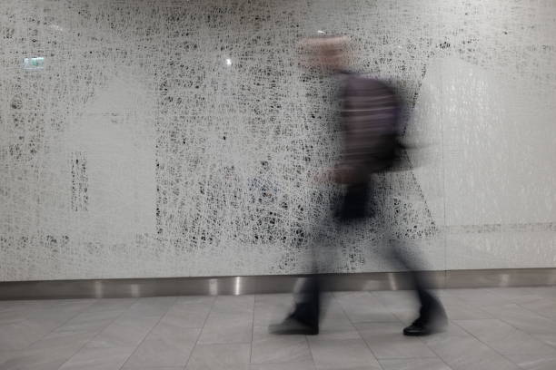 istock blurry person walking in the airport 950297052