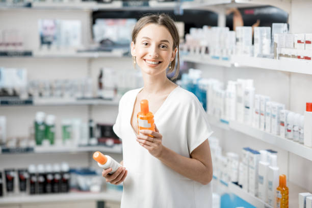 istock Woman choosing sunscreen lotion at the pharmacy 950299746