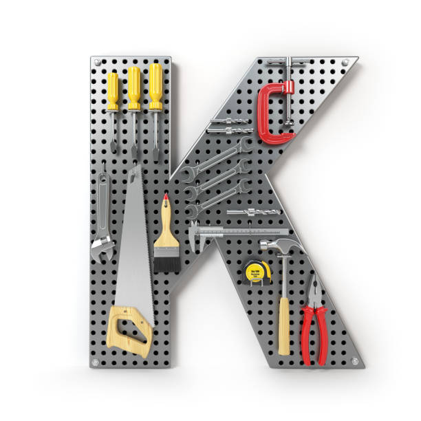 istock Letter K in the form of metal pegboard with tools isolated on white 950301378