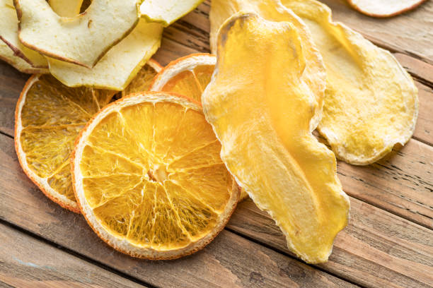 istock Dried fruit slices on  wooden background. 950301752