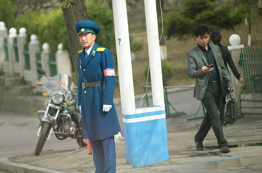 Pyongyang, 15th April 2018. A policeman controlling traffic in a street of the Capital city of North Korea