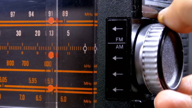 Tuning Analog Radio Dial Frequency on Scale of the Vintage Receiver