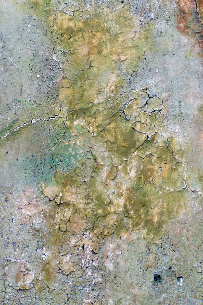 istock Old wall is painted with a multicolored paint which is irradiated, background 950304924