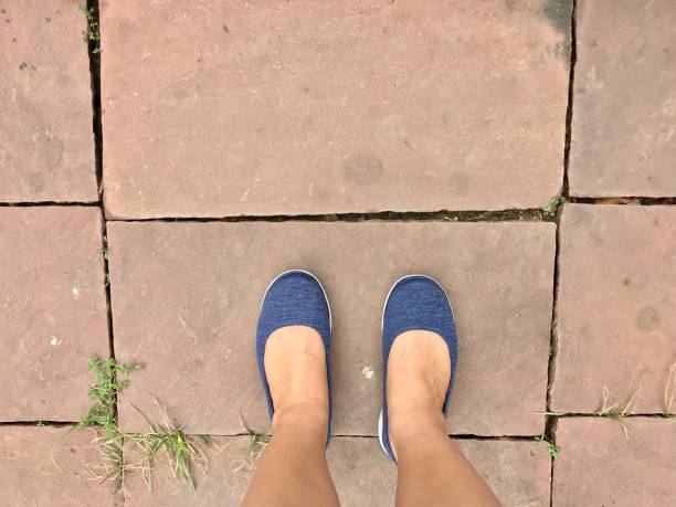 istock Woman wearing sneaker standing on the floor 950305092