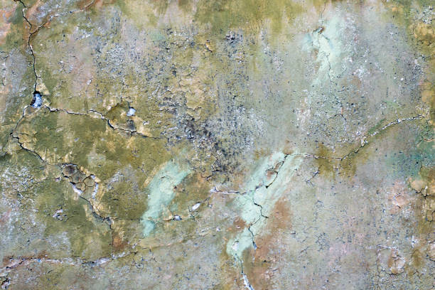 istock Old wall is painted with a multicolored paint which is irradiated, background 950305220