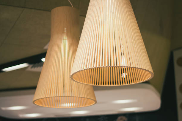две лампы в современном стиле висят в кафе - fashionable party design home decorating стоковые фото и изображения