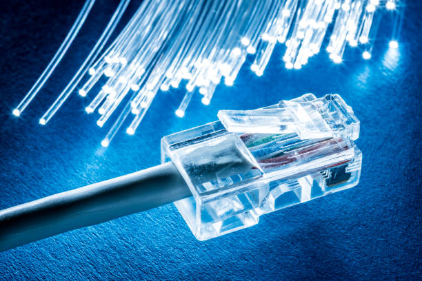istock Network cable and optical fibers with lights. 950305662
