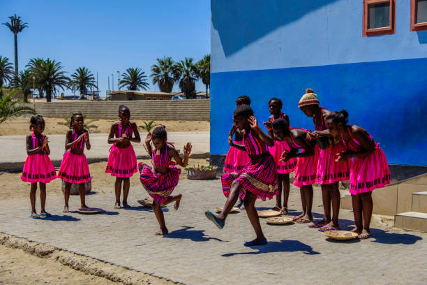 Swakopmund dancers Swakopmund, Namibia - 25 March 2018: Pretty young girls in beautiful pink costumes perform song and dance routine outside local school swakopmund photos stock pictures, royalty-free photos & images