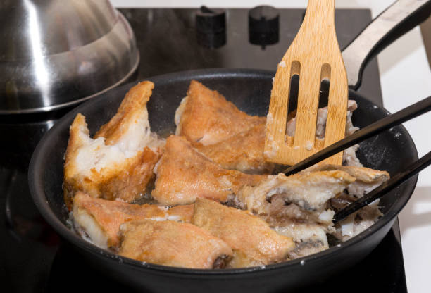 istock pieces of fish fried in a pan, kitchenware, cooking, cooker 950310872