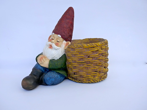 Garden Gnome with slipping pants and bare belly.\nIsolated on white background. (not protected by copyright)