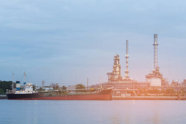 istock Oil refinery and tank boat river front skyline 950318150