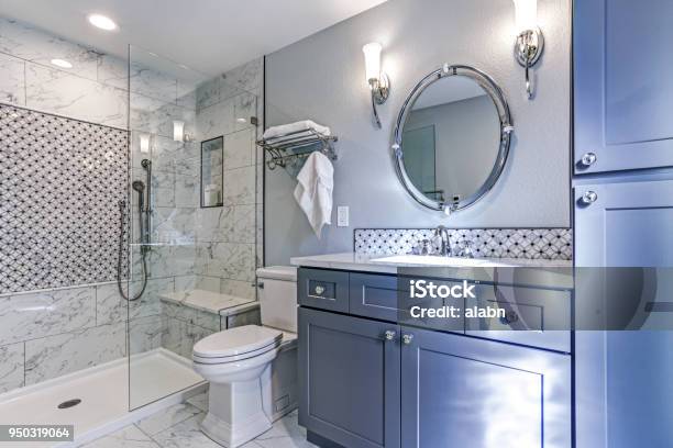 New Blue Bathroom Design With Marble Shower Surround Stock Photo - Download Image Now