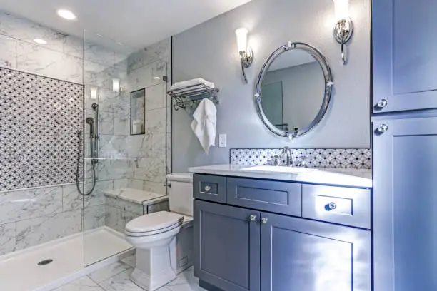 Photo of New blue bathroom design with Marble shower Surround