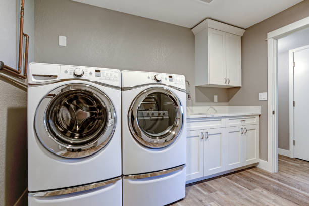 istock Laundry room with taupe walls and modern appliances. 950319726