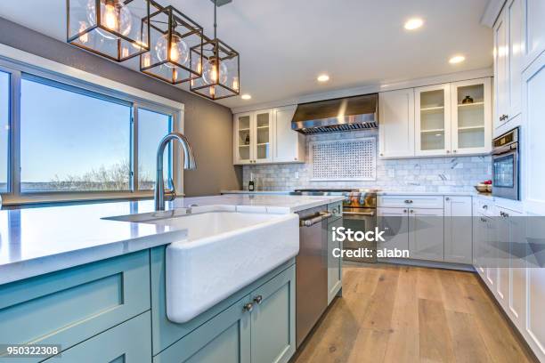 Beautiful Kitchen Room With Green Island And Farm Sink Stock Photo - Download Image Now