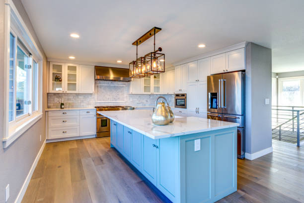 istock Beautiful kitchen room with green island. 950322906