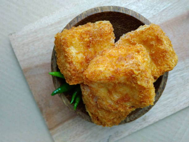 flat lays or top view, tahu sumedang (Fried Tofu) from west java, indonesia with green hot chili at Wooden small bowl photo flat lays or top view, tahu sumedang (Fried Tofu) from west java, indonesia with green hot chili at Wooden small bowl gorengan stock pictures, royalty-free photos & images