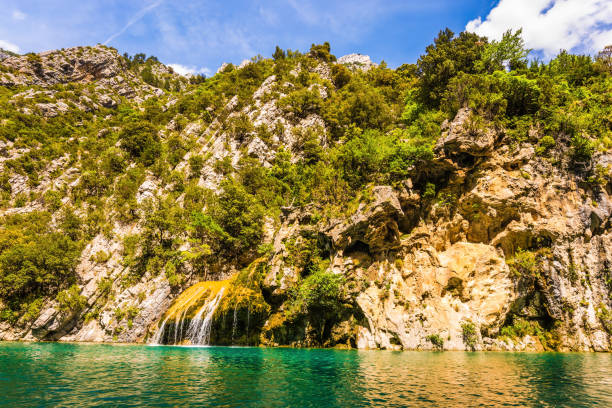 istock The waterfall on the wall of the gorge 950335738