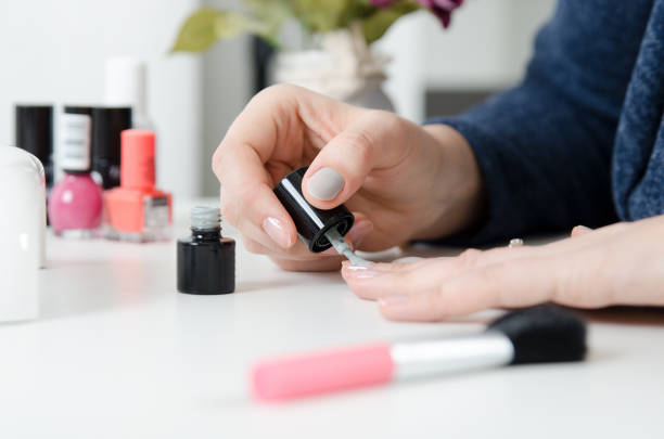 istock Woman painting her finger nails 950336534