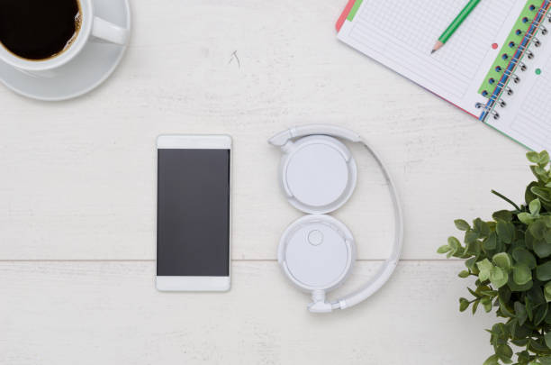 istock Office desk table layout with headphones and smartphone 950336660