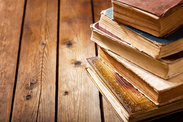 istock old books on a wooden table 950337248