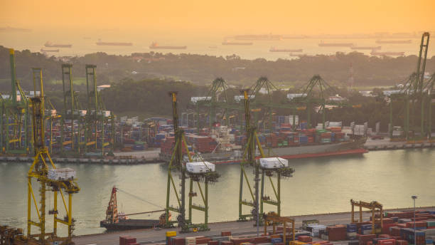 istock Container Cargo freight ship with working crane bridge in shipyard in singapore 950345976