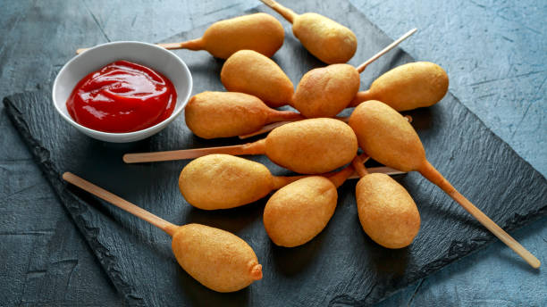 istock Mini Corn Dogs on stone platter with ketchup 950346186