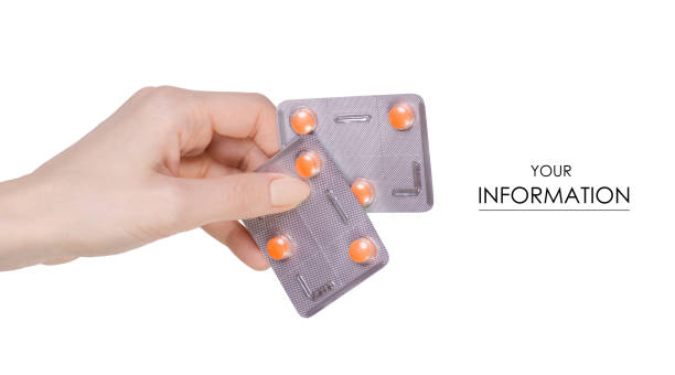 istock Medicine pills in blister, drug tablets in hand pattern 950354438