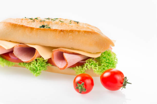 istock Sandwich with ham and vegetables isolated on white background 950354738