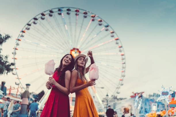 istock Happy women at the amusement park 950363824